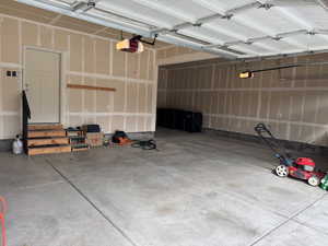 Garage featuring a garage door opener