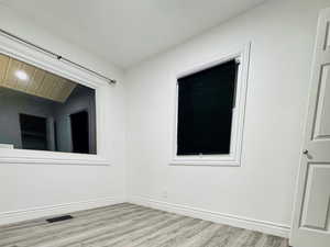 Empty room featuring light wood-style floors and baseboards