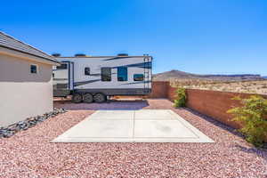 Fenced backyard with a mountain view