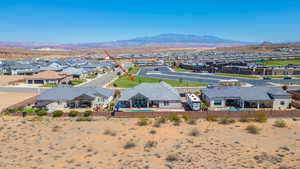 Aerial view of residential area featuring a mountainous background