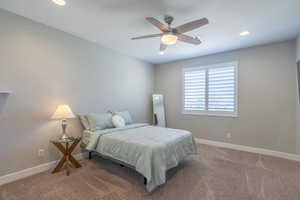 Bedroom featuring carpet, a ceiling fan, and recessed lighting