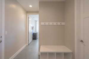 Mudroom featuring baseboards and tile patterned flooring