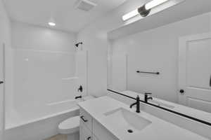 Bathroom featuring vanity and tub / shower combination