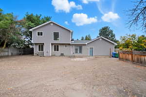 Rear view of property with a fenced backyard, a patio, and entry steps