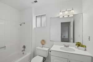 Full bath featuring bathtub / shower combination and vanity