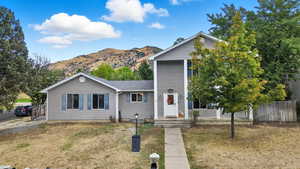 View of front of property with a mountain view