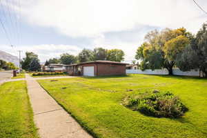 View of yard featuring a garage and a mountain view