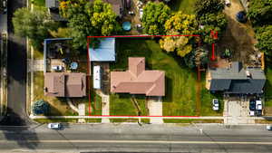 Aerial perspective of suburban area featuring property boundaries highlighted