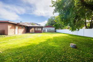 Fenced backyard with added family room