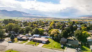 Aerial perspective of suburban area featuring a mountainous background