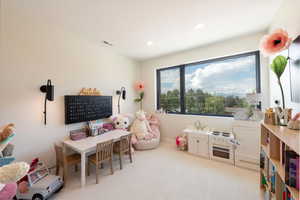 Rec room featuring light carpet and recessed lighting