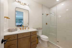 Full bathroom with recessed lighting, vanity, a walk in shower, and light tile patterned floors