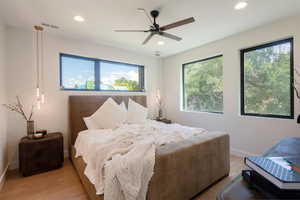 Bedroom featuring wood finished floors, recessed lighting, and ceiling fan