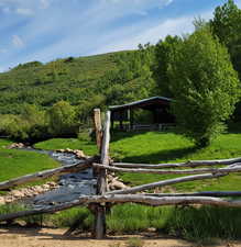 View of yard featuring a wooded view