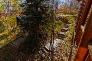View of yard featuring stairs