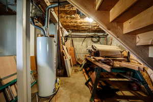 Unfinished basement with gas water heater