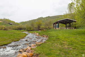 View of green lawn with a mountain view
