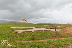 View of yard featuring a view of rural / pastoral area and a mountain view