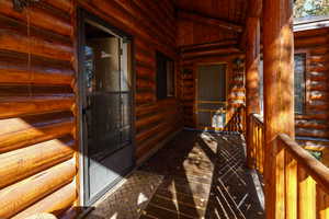Entrance to property with log exterior