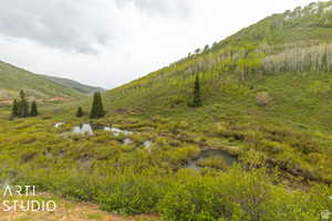 Mountain view featuring a nearby body of water