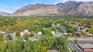 Aerial view of property's location with nearby suburban area and mountains