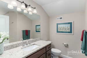 Upstairs full bathroom with a large vanity, lots of light, and very functional.