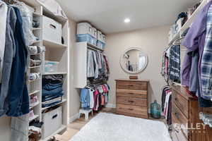 The Primary Closet has built-in dressers and has a walk-through to the bathroom and the laundry room.