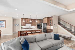 Looking from the fireplace into the kitchen view. This home is so open and functional.
