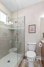 Glass shower in guest bath.