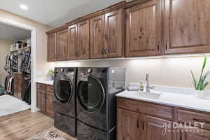 The laundry is connected to the Primary Closet and can be closed off with a pocket door.