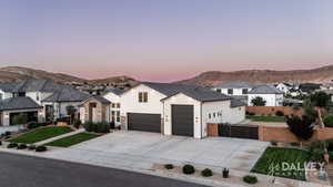 The oversized garage can easily accommodate an RV, boat, or large truck, and the spacious flat driveway provides plenty of additional parking for guests whenever needed.