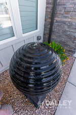 A water feature adds ambience by the front door.
