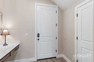 The built-in desk area makes a convenient drop zone when entering from the back garage door, with access to the under-stair storage just to the right.