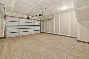 Garage featuring a garage door opener