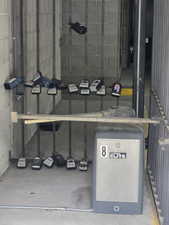 Keybox location near secured parking garage gate