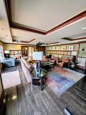 Common area with ornamental molding and recessed lighting