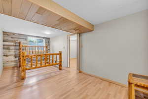 Spare room with wood finished floors and baseboards