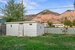 View of outbuilding featuring a mountain view