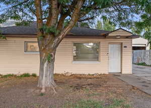 View of front of home with roof with shingles