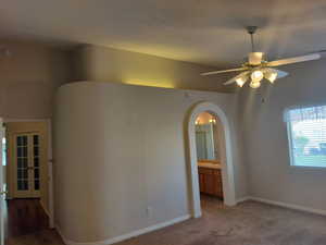 Primary Bedroom Arched Doorway to Bath, Vaulted Ceiling, Indirect Lighting
