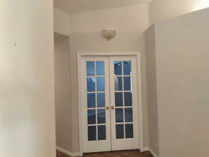 Doorway to Bedroom #2 featuring French Door Entrance