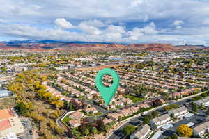 Aerial perspective of suburban area featuring a mountain backdrop