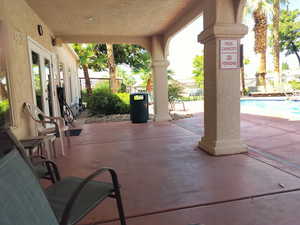 Covered patio / terrace by Outdoor pool