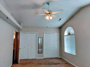 Bedroom #3 has full wall closets, carpet flooring, and ceiling fan