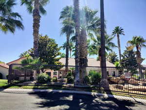 View of front of home featuring a gate