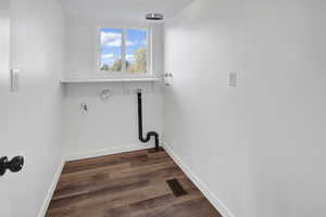 Laundry room featuring dark wood-type flooring, gas dryer hookup, and hookup for a washing machine