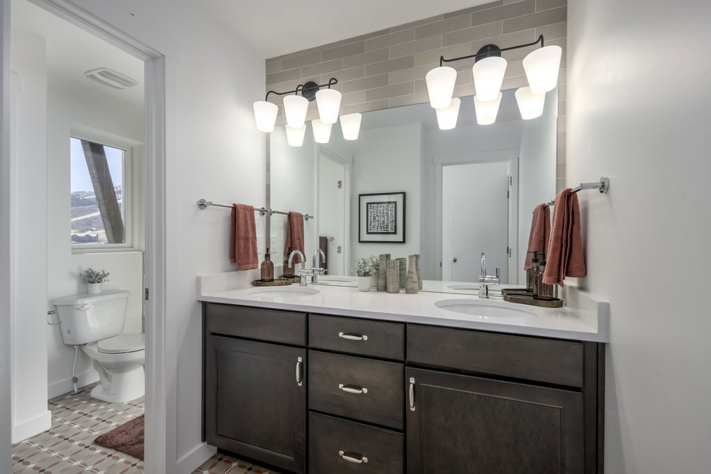 Dual sinks = relationship saver. Plus a walk-in shower that actually feels spa-worthy.