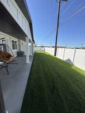 Fenced backyard featuring a patio area
