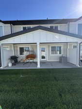 Rear view of property featuring a patio area