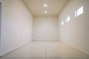 Spare room featuring dark aggregate flooring